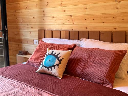 a bed with two pillows on top of it at Thethi Villas in Theth