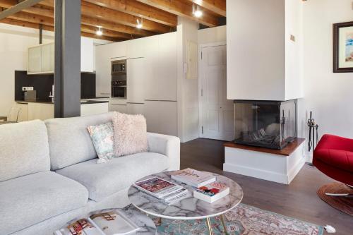a living room with a couch and a table at Val Arties 3 by FeelFree Rentals in Arties