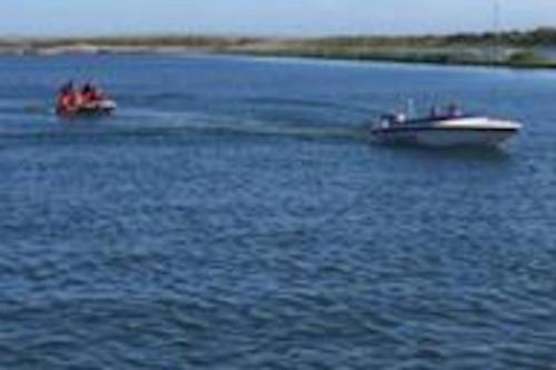 two boats on a large body of water at Parkview, Port Haverigg in Haverigg