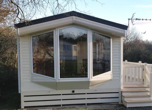 a screened in porch of a tiny house at Parkview, Port Haverigg in Haverigg