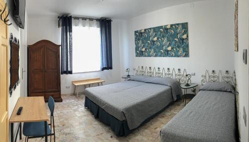 Postel nebo postele na pokoji v ubytování BeB Terrazza del Sole
