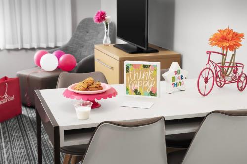 a table with a plate of cookies on it at TownePlace Suites by Marriott Franklin Cool Springs in Franklin