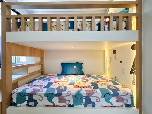 a bunk bed in a childs bedroom with an elephant crib at Charming 4BR House in Northwest Park, West Surabaya by Le Ciel Hospitality in Surabaya