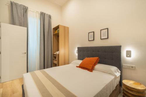 Ένα ή περισσότερα κρεβάτια σε δωμάτιο στο QE Apartments