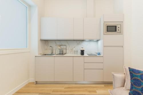 Η κουζίνα ή μικρή κουζίνα στο QE Apartments
