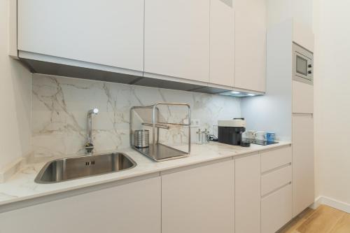 Η κουζίνα ή μικρή κουζίνα στο QE Apartments
