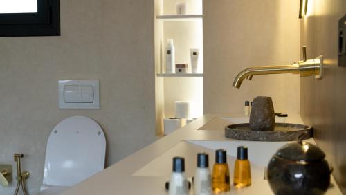 a bathroom with a sink with a toilet and a sink at Villa Pacifica Nador in Nador