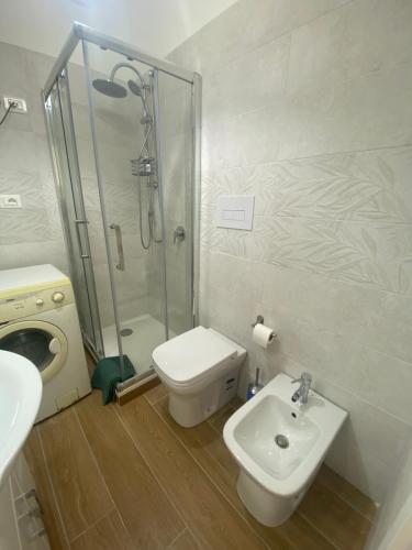 a bathroom with a shower and a toilet and a sink at Mior Case Vacanze in Palinuro