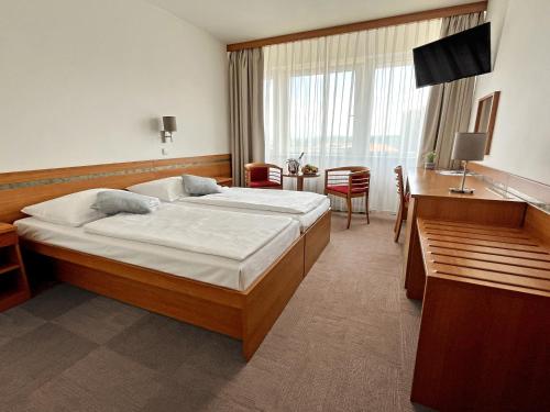 Postel nebo postele na pokoji v ubytování Hotel ILF