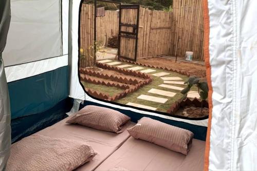 a inside of a tent with two pillows in it at The Black & White Box Villa - Genting Highland Foot Area in Bentong