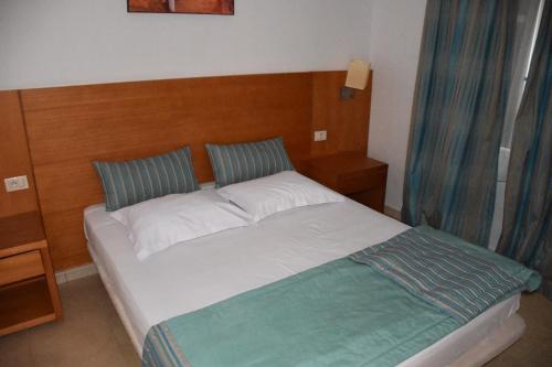 Voodi või voodid majutusasutuse Bungalow de Luxe en Bord de Mer a Nabeul toas