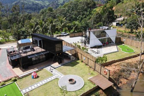 an aerial view of a house with a backyard at The Black & White Box Villa - Genting Highland Foot Area in Bentong