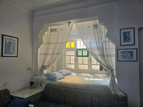 Postel nebo postele na pokoji v ubytování Maisonnette style Andalous MONSAFA