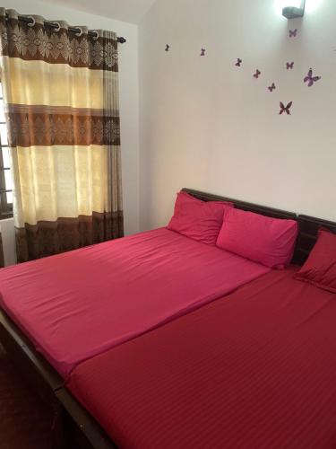 Postel nebo postele na pokoji v ubytování Beach Guest House Addalaichenai