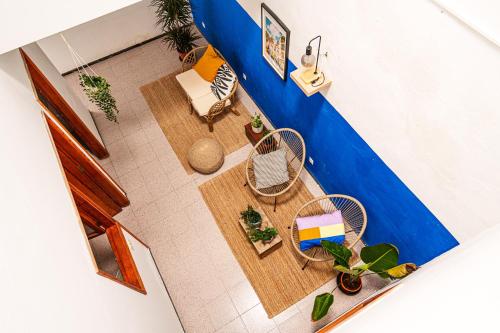 an overhead view of a living room with a table and chairs at Doña Rose Surf Hostel in Las Palmas de Gran Canaria