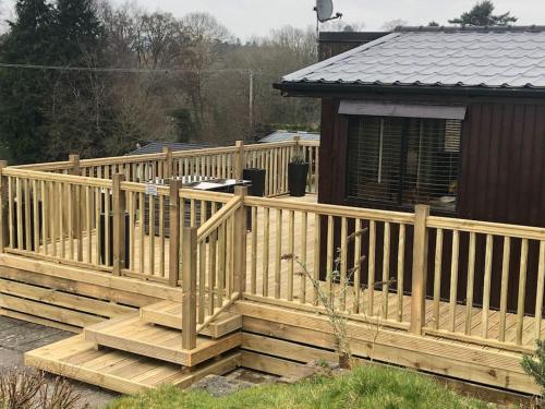 a wooden deck in front of a house at 5f Stanley Lodge, Caer Beris, Builth Wells - No tradesman in Builth Wells