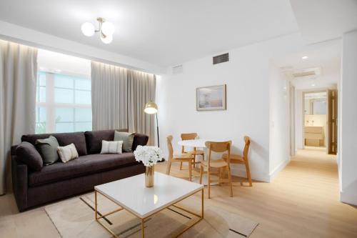 a living room with a couch and a table at Vonder Miami Beach - Unit 6 in Miami Beach