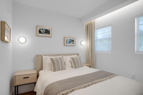 a white bedroom with a bed and a window at Vonder Miami Beach - Unit 15 in Miami Beach