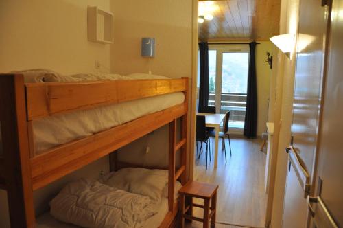 Rúm í herbergi á Meije 7 - B1 - Studio raffraichi - 4 pers