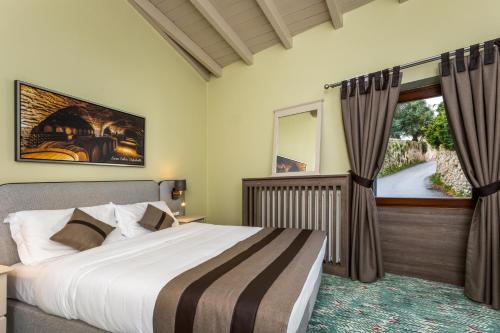 Ένα ή περισσότερα κρεβάτια σε δωμάτιο στο Castrum Wine Relais