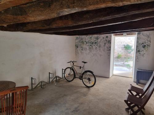 a bike parked in a room with a window at La suite du Docteur Privey - Free & secure Park Bike - 3mn Autoroute in Tournus