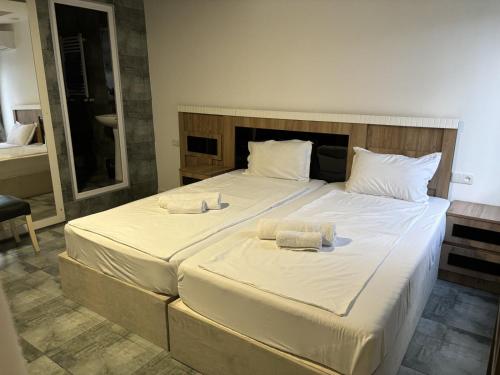 Postel nebo postele na pokoji v ubytování Kai Hotel Bar