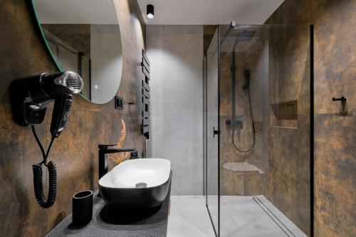 a bathroom with a shower and a toilet and a sink at Osada Widokowa Kościelisko in Kościelisko