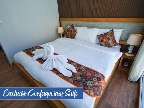 Postel nebo postele na pokoji v ubytování The Consorts Hotels & Resorts HUNZA ATTABAD LAKE