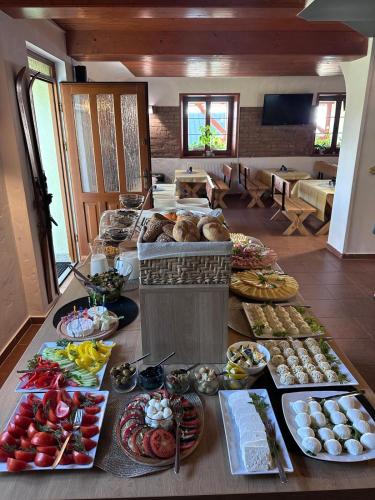 a table with many different types of food on it at Pod Orlicą in Duszniki Zdrój