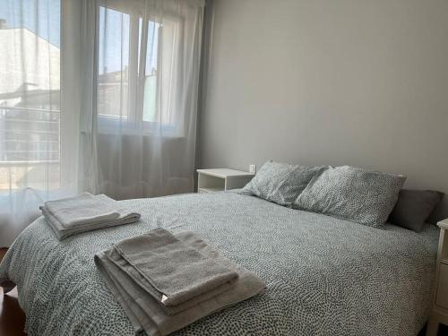 Una cama o camas en una habitación de Increíble dúplex en Lugo