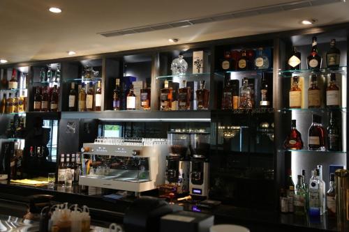 a bar with a lot of bottles of alcohol at T Hotel in Taichung