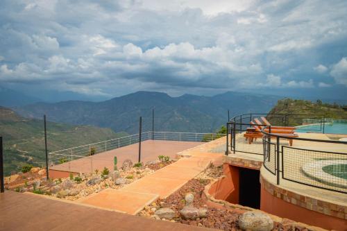 a balcony of a house with a view of the mountains at Hotel Aborígenes in Los Santos