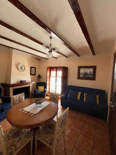 a living room with a table and a couch at Casa Rural Sant Antoni in Biar