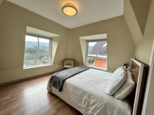 Cama ou camas em um quarto em Flats Chateau Campos do Jordão