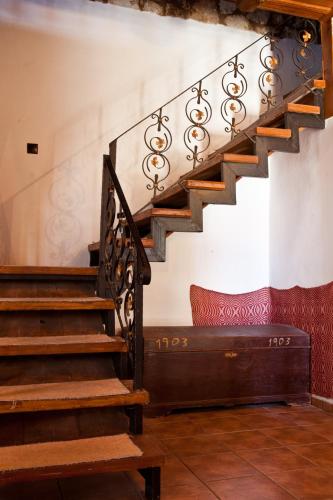 a set of stairs in a room with a bench at Tsivaras Villas in Tsivarás