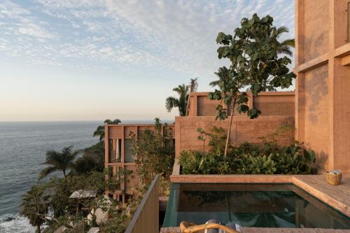 a building with a view of the ocean at Rosa Morada Luxury Villas with Private Beach in San Francisco