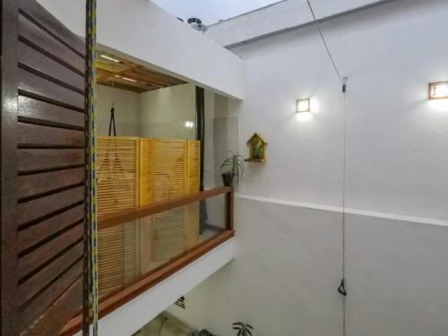 a bathroom with a shower and a glass door at Casa do sol in Sao Paulo