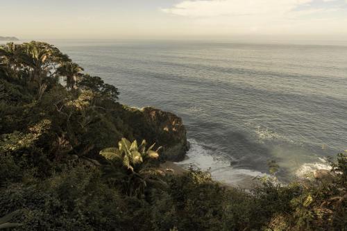 an aerial view of the ocean from a cliff at Rosa Morada Luxury Villas with Private Beach in San Francisco