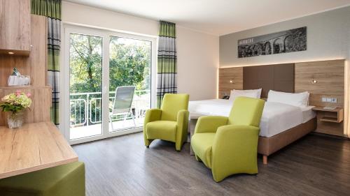 Postel nebo postele na pokoji v ubytování Ringhotel Zweibruecker Hof