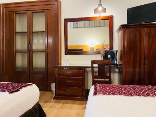 Postel nebo postele na pokoji v ubytování Hotel Historia