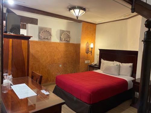 Postel nebo postele na pokoji v ubytování Hotel Historia