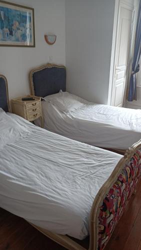 Una cama o camas en una habitación de L'Art Doize