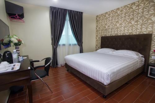 Postel nebo postele na pokoji v ubytování Elmark Hotel Johor