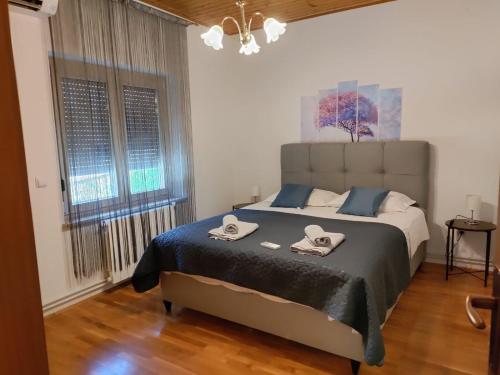 Postel nebo postele na pokoji v ubytování Apartman Bulić