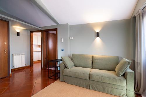 a living room with a couch and a table at Hotel Tiziano in Venice