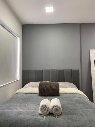 Ένα ή περισσότερα κρεβάτια σε δωμάτιο στο Casa Cremerie Suites
