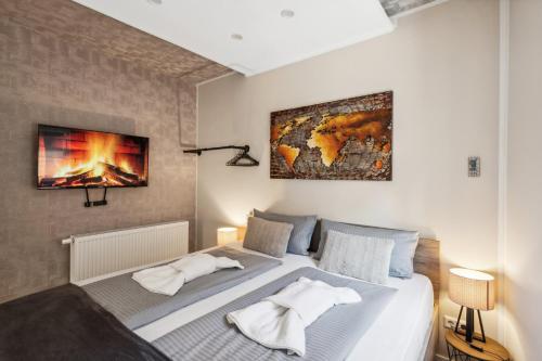 a bedroom with a large bed with a fireplace at Garten - Bergblick - SmartTV - Parkplatz - HarzLounge in Thale