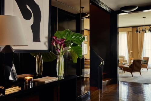 a living room with a vase with flowers in it at Fasano Fifth Avenue I Private Members Club & Hotel in New York