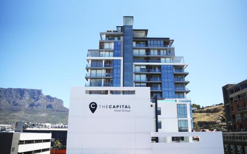 a large building with a large clock on it at The Capital Mirage in Cape Town