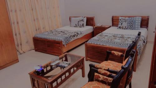 Ein Bett oder Betten in einem Zimmer der Unterkunft Hotel Royal Residency